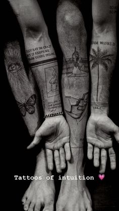 two men with tattoos on their arms and hands are holding each other's hand