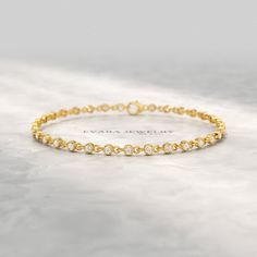 Delight her with our 0.80 Carat Bezel Set Diamond Tennis Bracelet, featuring lab-grown diamonds in a dainty and elegant design. This tiny 14K yellow gold bracelet exudes sophistication, making it a perfect personalized push present for her. Crafted with precision, it combines timeless beauty with modern elegance. Celebrate special moments with this exquisite bracelet from Evara Jewelry, designed to be cherished and admired forever. 𝐅𝐞𝐚𝐭𝐮𝐫𝐞𝐬: * 𝐌𝐚𝐝𝐞 𝐭𝐨 𝐎𝐫𝐝𝐞𝐫 * 𝐌𝐞𝐭𝐚𝐥: 𝟏𝟎? Push Present, Present For Her, Diamond Tennis Bracelet, Bezel Set Diamond, Presents For Her, Yellow Gold Bracelet, Tennis Bracelet Diamond, Special Moments, Tennis Bracelet