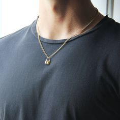 High Quality Stainless Steel Gold Lock Pendant Necklace for Men or WomanYou'll love this stainless steel handmade lock necklace! You can wear it with confidence knowing that it won't tarnish or lose its shine! This is a durable, long lasting and comfortable piece of jewelry. Plus, with a customizable length, you can choose the length to suit your style and comfort. This lock necklace can symbolize different meanings such as love, protection, or the unlocking of new possibilities. This is the per Mens Lock Necklace, Gold Metal Necklaces For Everyday Use, Minimalist Everyday Jewelry With Lock Detail, Everyday Gold Chain Jewelry, Metal Chain Necklace With Lock For Gift, Lock Pendant, Chain For Men, Lock Necklace, Mens Chain Necklace