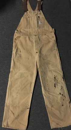 Vintage 70s 80s Carhartt Unlined Faded distressed Paint overalls in tan/light brown in sz. 36/29. Various fading/Spotting/paint/wear as pictured. Made in the USA. No size tag, see measurements for reference. See pictures for condition/wear. ******PLEASE MAKE SURE YOU READ AND UNDERSTAND THESE GUIDELINES****** ALL SALES FINAL so understand what you are purchasing. The pictures in this listing and the description are all part of the item description so make sure you have examined all measurements, Steampunk Overalls, Paint Overalls, Finn Costume, 1987 Fashion, Painted Overalls, Brown Overalls, Distress Paint, Carhartt Overalls, Modern Cowboy