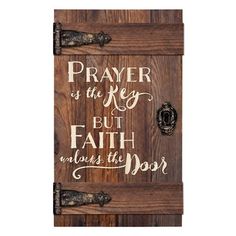 a wooden plaque with the words, prayer is the key but faith without the door