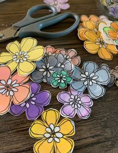 the paper flowers have been cut out to look like they are being used for crafts