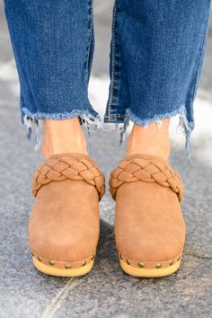 Take cute to a whole new level this season in the Taylor Braided Clogs In Brown! A smooth faux leather shapes a rounded toe with braided detail and wooden sole decorated in metal studs. Pair these cute clogs with all your fall fits for a complete look! True to size + Lightweight Faux leather + Matte Approx. 2 3/4" heel Keywords: Clog, Mule, Braided, Brown, Shoe Halloween Graphic Tees, Fall Fits, Brown Shoe, Mule, Jumpsuit Dress, Stylish Outfits, Clogs, Jumpsuit Romper, Lounge Wear