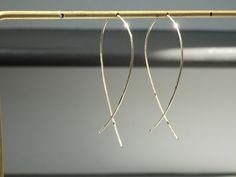 "Simple and dainty gold filled wire earrings that slips through the ear lobes and criss-crosses in place.  Threads into earlobe while keeping its shape. Width is about 1.15\" at its widest point and 2\" tall." Simple Wire Earrings, Wire Crosses, Loop Earrings, Minimalist Gifts, Earrings Simple, Threader Earrings, White Ribbon, Wire Earrings, Simple Earrings