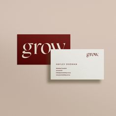 two business cards sitting on top of each other with the word grow printed on them