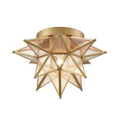 a ceiling light that is shaped like an origami star and has gold trim