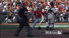 a baseball player is running to first base