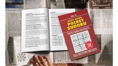 an open book with the words easy hand pocket sudoku on it