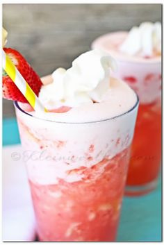 two glasses filled with ice cream and strawberries