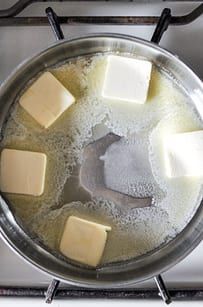 butter cubes and other ingredients in a pan on the stove