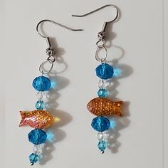 Handmade By Me In Birmingham Alabama, These Are One Of Three Designs I Have Made Up Right Now In These, You May However Choose Your Own Style, Colors, Hooks Etc. See The Last Few Photos Of The Other Colors, These Are The 18k Gold Plated Filigree Hooks With Blue And Clear Bubbles With Orange Murano Glass Lampwork Fish Bead. All Beads Used Here Are Glass. Very High End Swarovski Crystal, Art Glass, And Glass All Used In The Designs. Leverbacks Are Available As Well As Hoops Too. See Other Options. Goldfish Earrings, Lampwork Bead Jewelry, Marquise Earrings, Bubble Earrings, Crystal Heart Earrings, Lampwork Earring, Black Earrings Dangle, Glass Drop Earrings, Glass Lampwork