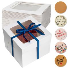 a white box filled with lots of cards and a blue ribbon