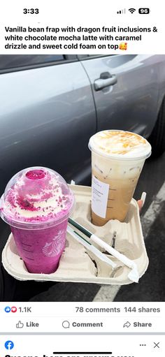 two drinks are sitting on a tray in front of a car