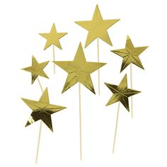 five gold stars on top of toothpicks in the shape of pinwheels