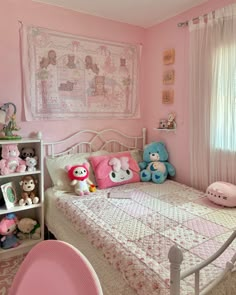 a bedroom decorated in pink and white with lots of stuffed animals on the bedspread