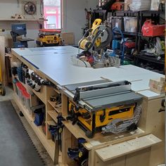 a workbench with tools on it in a garage