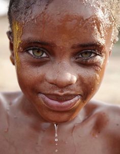 a close up of a person with mud on their face