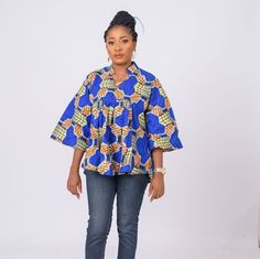 Fierce and feminine , this Ankara top has a unique in a relaxed, easy fit, oversize fit. You'll love how well it pairs with jeans and leggings bringing the high fashion drama you crave. V-neclline Short flared sleeves Cool iron as needed Pullover style Split-neck tunic Ankara Plus Size, Ankara Tops, Women Blouse, Flared Sleeves, Traditional Outfits, Oversized Fits, Ankara, Pullover Styling, Womens Clothing Tops