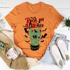 Rock On Witches Tee #dailyparenting #hotmess #millennialmom #teacherfashion #comfystyle #keepingitreal #peachysunday #sahm #women #igmoms Trendy Stretch Fall T-shirt, Halloween Stretch Tops With Letter Print, Trendy Stretch T-shirt For Fall, Stretch Graphic Tee For Fall, Faith Tees, Fall Tee, Rock On, Halloween Tees, Mom Tees