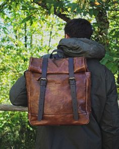 This backpack is practical and stylish, with security pockets, hidden closures, a grab handle on top, and two comfortable, adjustable back/shoulder straps. Use it for both travel and work with ease. Handcrafted of full-grain Italian calfskin in luxurious vegetable-tanned leather and crafted into stunning rustic bags and accessories that develop an enhanced patina with age. Made in Italy, each piece is finished with durable gingham linings and metal hardware. Dimensions: 14 x 12.5 x 5.5" WARNING: Travel And Work, Top Backpacks, Leather Roll, Back Shoulder, Bags And Accessories, Mountain Backpack, Metal Hardware, Vegetable Tanned Leather, Bradley Mountain