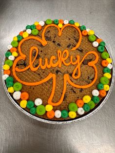 a cookie cake with the word lucky on it