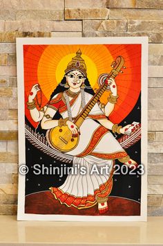 Goddess Saraswati (Indian Folk Art) Size A3 (29.7cm X 42cm) Acrylic Knowledge is the greatest asset that a human mind has, cultivating that knowledge can help one become more confident and successful. Just like religions across the world, in Hinduism, Knowledge and learning finds a patroness in the form of Goddess Saraswati. Goddess Saraswati is one of the most revered Hindu deities in India and in Hinduism. She is known as the Hindu goddess of knowledge, music, art, speech, wisdom and learning. #heytheremaker  #homedecor  #indianhomedecor  #ukartist   #artforsale  #buyart  #collectibles,  #interiorinspiration,  #interiordecor,  #homedecor, #houseinterior,  #interiordesignideas,  #buyartonline,  #fineart,  #indianart,  #indianfolkart,  #indianartists,  #indianartistinlondon,  #artcurator, Saraswati Art, Art Recreation, Goddess Of Knowledge, Art Mini Toile, Goddess Saraswati, Art Papillon, Saraswati Goddess, Sketches Pencil