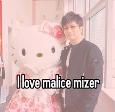 a man standing next to a hello kitty doll with the caption i love naice mizer