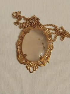 "Beautiful oval shaped cabochon pendant with a pale blue see thru color. Decorative gold tone filigree setting. Pendant is 2x1.15\" on a gold tone 17\" chain. Excellent condition, never worn.  Smoke free home." Luxury Cabochon Necklace For Women, Luxury Rose Gold Oval Cabochon Jewelry, Luxury Engraved Oval Cabochon Jewelry, Cabochon Pendant, Oval Cabochon, Pale Blue, Locket, Pendant Necklaces, Necklace Etsy