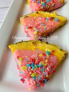 three slices of pineapple with sprinkles on a white plate, ready to be eaten