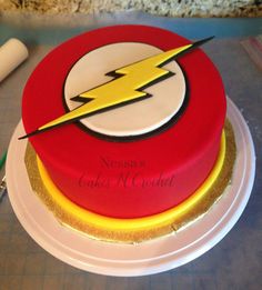 a birthday cake with the flash logo on it