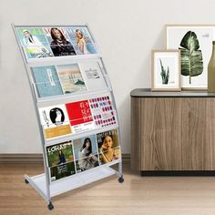 a magazine rack sitting on top of a hard wood floor