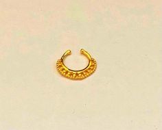 22k Solid Gold nose Septum- Real nose gold hoop- Solid gold nose Septum- Real Gold nose Fake Septum , Indian nose gold Septum, nose hoop, tribal nose Septum, tribal nose hoop- Gold Septum - Nose Gold Septum Unique solid 22k Gold jewellery, handmade by Indian artists Tribal 22k Gold Minimal Nose Septum , can be worn as tiny fake earring. Our jewellery artist made these design with full dedication and love after analysing all the Rajasthani Indian culture and Rajasthani designs so that a perfect c Gold Nose Rings For Festivals, Gold Temple Jewelry Nose Rings For Festivals, Bohemian Gold Septum Ring For Festivals, Gold Temple Jewelry Nose Rings For Ceremonial Use, Bohemian Gold Nose Rings For Festival, Gold Temple Jewelry Nose Rings For Ceremonial Occasions, Handmade Adjustable Gold Septum Ring, Gold Temple Jewelry Nose Rings For Puja, Traditional Gold Septum Ring Gift