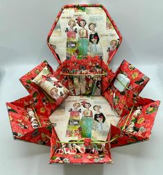 an origami box with many pictures on it