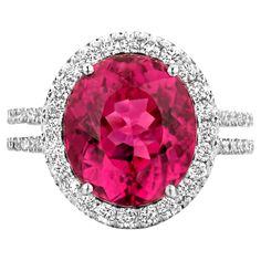 One of a kind cocktail ring in 18-Karat white gold (7,4g) set with 1 eye clean oval cut Rubelite Tourmaline, 0.81Ct pink sapphires set in dégradé pavé (dark, medium, light) and the finest white diamonds 0.70Ct VS/F quality in brilliant cut. Celine Roelens, a goldsmith and gemologist as well, is specialized in unique, fine jewelry, handmade in Belgium and brought to life by experienced craftsmen. Original pieces made from precious materials of exceptional quality. When designing her creations, Celine resolutely opts for color. In this process, top quality colored stones and durability are at the top of the list. A quest that takes her to the farthest corners of the world. Her finest tourmalines come from Madagascar, her rarest sapphires from Sri Lanka. "All my jewelry designs revolve around Colored Stones, Diamond Cocktail Rings, Sapphire Diamond, White Diamonds, Cocktail Ring, Jewelry Handmade, Pink Sapphire, Cocktail Rings, Earings Piercings