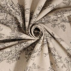 a close up view of a fabric with flowers and birds on it, in black and white