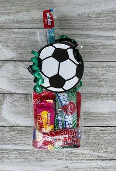 a bag filled with candy and a soccer ball