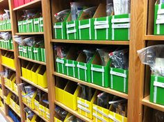 the shelves are filled with many different colored boxes