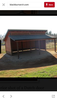 an image of a horse barn in the middle of a field