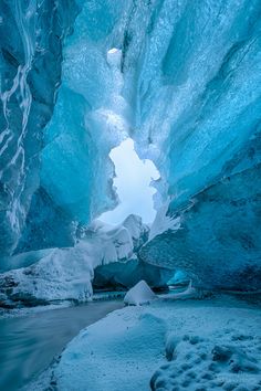 the inside of an ice cave with water running through it