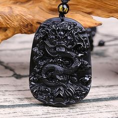 Chinese Dragon Obsidian Necklace - Courage and Endurance Black Dragon Design Jewelry Gift, Black Jewelry With Dragon Design For Gift, Black Obsidian Amulet Necklaces, Black Obsidian Amulet Necklace, Traditional Black Onyx Necklace, Black Spiritual Jewelry With Dragon Design, Black Carved Spiritual Necklace, Spiritual Black Jewelry With Dragon Design, Black Carved Jewelry Gift