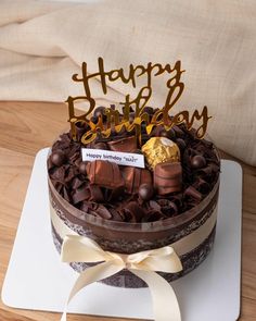 a birthday cake with chocolate decorations on top