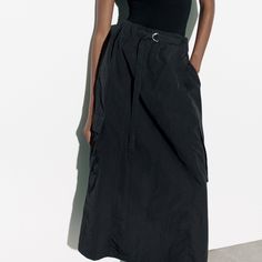 Polyamide Summer Black Maxi Skirt With Pockets, Black Maxi Skirt For Workwear In Summer, Black Maxi Skirt For Summer Workwear, Black Cargo Skirt For Spring, Black Cargo Skirt For Spring Workwear, Casual Black Cargo Skirt For Work, Black Flowy Maxi Skirt With Pockets, Flowy Black Maxi Skirt With Pockets, Casual Black Lined Cargo Skirt