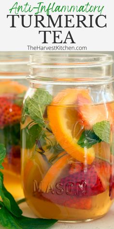 a mason jar filled with sliced fruit and mint