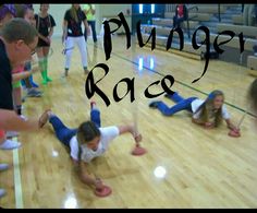 a group of young children on the floor with words reading plunger race above them