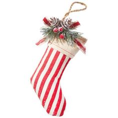 a red and white striped christmas stocking hanging from a rope