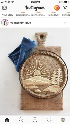 a pie sitting on top of a wooden cutting board