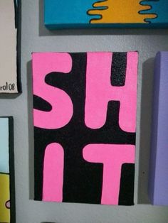 several pieces of art are hanging on the wall with pink and black letters that spell out shut