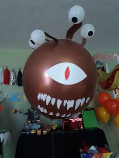 a balloon with eyes and teeth on it