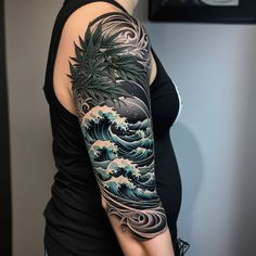 a woman's arm with an ocean wave and palm tree tattoo on her left arm