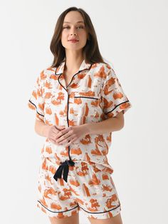 DESCRIPTION:A relaxed pajama set made from a soft cotton blend with an Austin-inspired print.FEATURES:Notch CollarLeft Chest PocketButton-Down FrontMatching ShortElastic WaistbandContrast PipingAll-Over Novelty Print50% Modal, 50% CottonRelaxed FitModel is wearing size Small pajama set.Model's Measurements: Height: 5'10.5" | Bust: 32C | Waist: 26" | Hips: 37" | Dress Size: 4 (US) Katie Kime, Saint Bernard, Burnt Orange, Pajama Set, Austin, Pajamas, Cotton Blend, Size 4, Orange